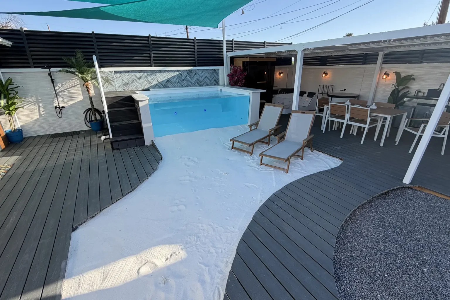 Private white sand grounding beach beside the heated pool