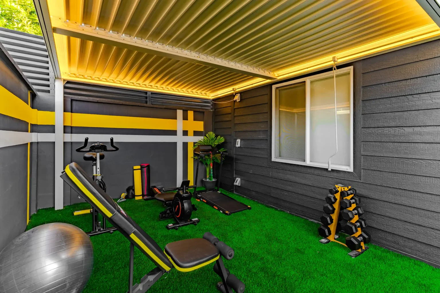 Covered private gym with strength equipment