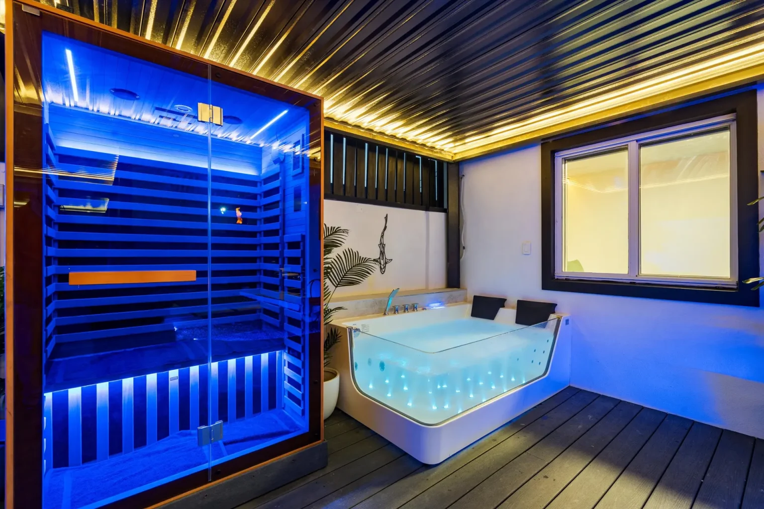 Private jacuzzi beside an infrared sauna